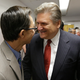 Assemblyman Ed Chau, left, and Sen. Bob Hertzberg celebrate after their internet privacy bill was approved by the Senate Judiciary Committee, June 26, 2018, in Sacramento.